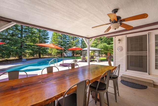 15947 Butterfield Ln, Anderson, CA 96007 - view of patio / terrace featuring ceiling fan and an outdoor pool