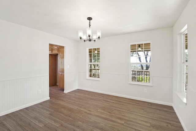 13360 Oak Run Rd, Oak Run, CA 96069 - unfurnished room featuring wood finished floors, a chandelier, and baseboards