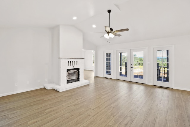 13360 Oak Run Rd, Oak Run, CA 96069 - unfurnished living room with a ceiling fan, french doors, a fireplace, vaulted ceiling, and light wood-style floors