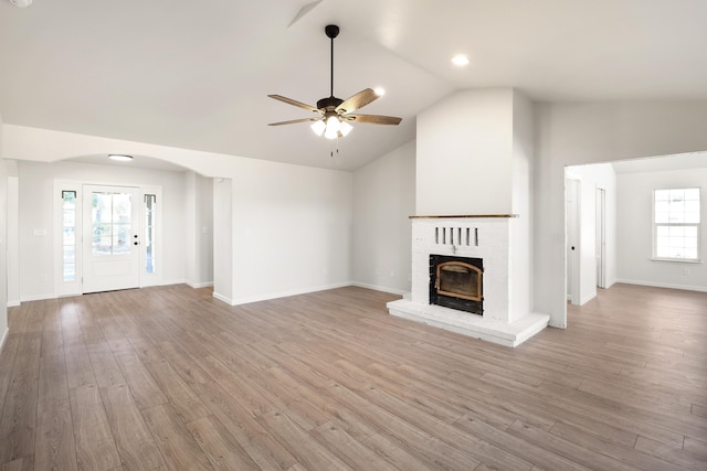 13360 Oak Run Rd, Oak Run, CA 96069 - unfurnished living room featuring a ceiling fan, a fireplace, lofted ceiling, light wood-style flooring, and baseboards