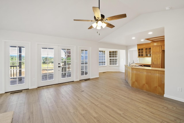 13360 Oak Run Rd, Oak Run, CA 96069 - unfurnished living room with vaulted ceiling, french doors, light wood finished floors, a sink, and ceiling fan