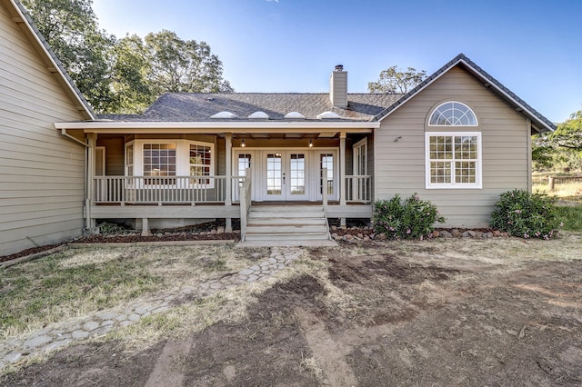 13360 Oak Run Rd, Oak Run, CA 96069 - ranch-style house featuring french doors, a chimney, a porch, and roof with shingles