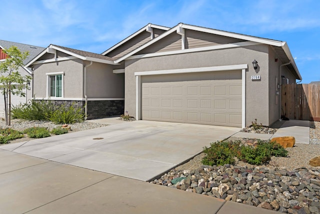 2764 Austere Ave, Redding, CA 96003 - ranch-style house with stucco siding, an attached garage, concrete driveway, and stone siding