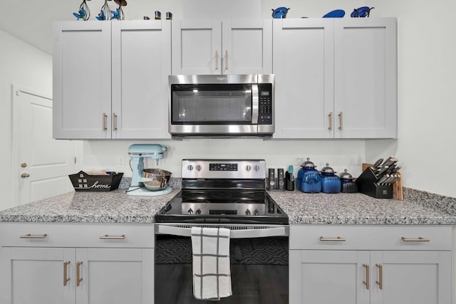 2764 Austere Ave, Redding, CA 96003 - kitchen with appliances with stainless steel finishes and light stone countertops