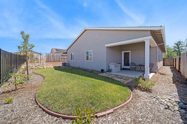 2764 Austere Ave, Redding, CA 96003 - back of property with stucco siding, central air condition unit, and a patio area