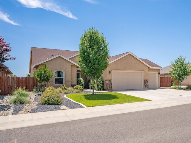 2830 Calaveras Ct, Redding, CA 96002 - view of front of home with stucco siding, an attached garage, and concrete driveway
