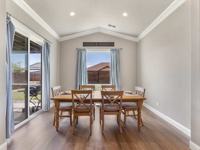 2830 Calaveras Ct, Redding, CA 96002 - dining room featuring wood finished floors, healthy amount of natural light, baseboards, lofted ceiling, and crown molding