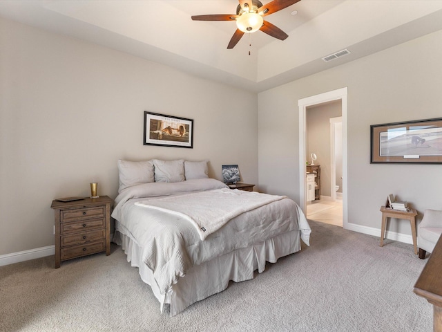 2830 Calaveras Ct, Redding, CA 96002 - bedroom with light carpet, baseboards, ceiling fan, and connected bathroom