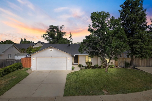 853 Paramount Way, Redding, CA 96003 - view of front of property with stucco siding, driveway, and an attached garage