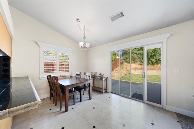 853 Paramount Way, Redding, CA 96003 - dining room with a chandelier, baseboards, and lofted ceiling
