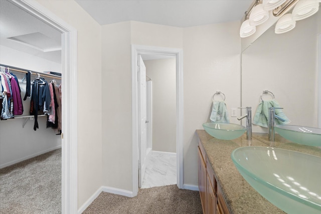 853 Paramount Way, Redding, CA 96003 - full bathroom featuring double vanity, a spacious closet, and baseboards