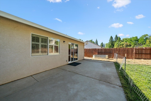 853 Paramount Way, Redding, CA 96003 - fenced backyard featuring a hot tub and a patio area