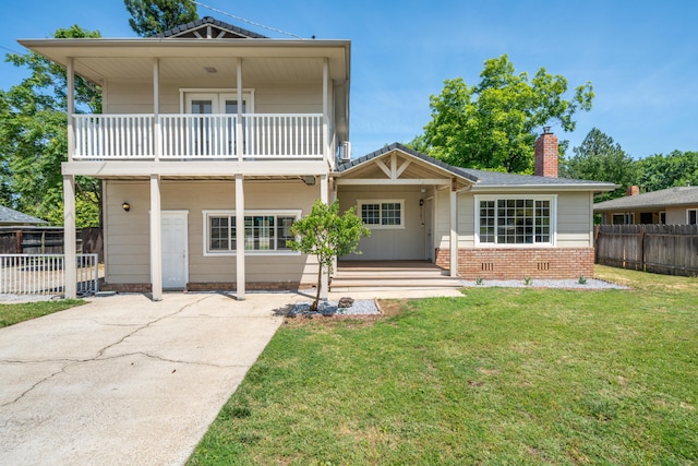 5101 Bidwell Rd, Redding, CA 96001 - view of front of home featuring a balcony, a chimney, a porch, and brick siding