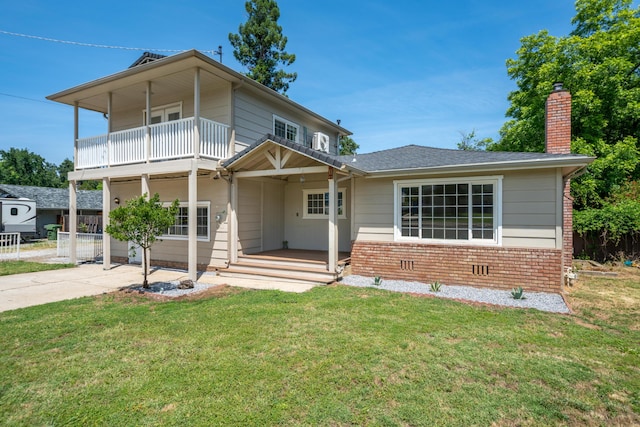 5101 Bidwell Rd, Redding, CA 96001 - view of front of property with a balcony, a chimney, brick siding, and a porch