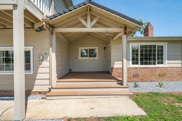5101 Bidwell Rd, Redding, CA 96001 - view of exterior entry with a chimney and brick siding