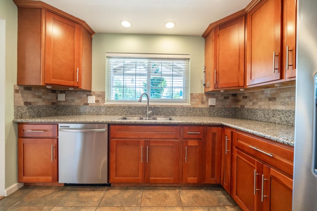 5101 Bidwell Rd, Redding, CA 96001 - kitchen with dishwasher, a sink, tasteful backsplash, brown cabinetry, and light stone countertops