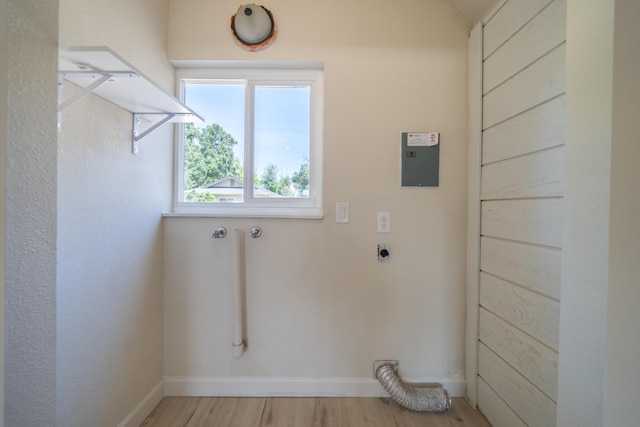 5101 Bidwell Rd, Redding, CA 96001 - laundry area featuring hookup for an electric dryer, light wood-type flooring, and baseboards