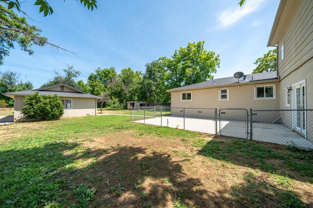 5101 Bidwell Rd, Redding, CA 96001 - view of yard featuring a patio and a gate