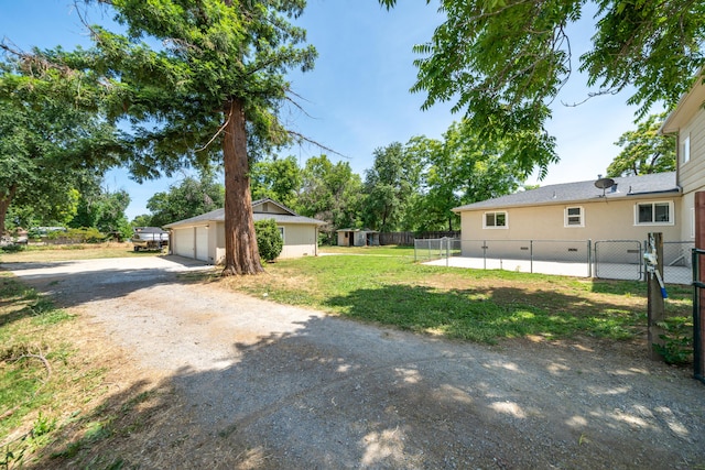 5101 Bidwell Rd, Redding, CA 96001 - view of yard with a garage, an outbuilding, and driveway