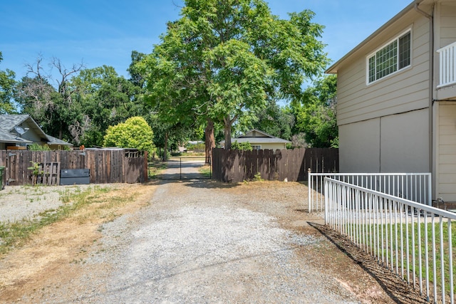 5101 Bidwell Rd, Redding, CA 96001 - view of dirt / gravel driveway featuring a gated entry