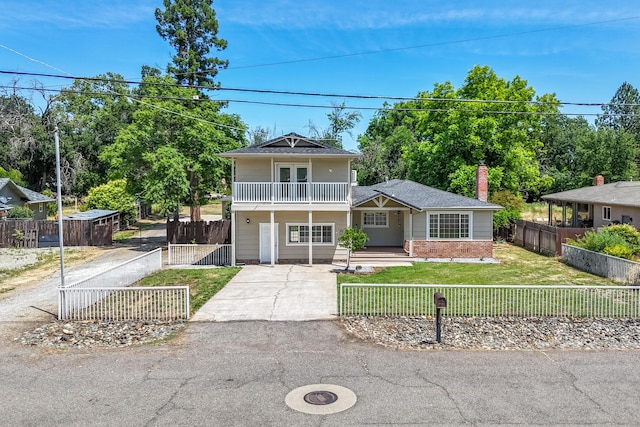 5101 Bidwell Rd, Redding, CA 96001 - view of front facade featuring a balcony, driveway, a porch, and brick siding
