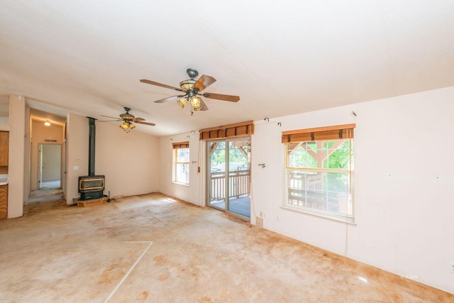 31 Rocky Rd, Weaverville, CA 96093 - unfurnished living room featuring a wood stove, carpet, and a ceiling fan