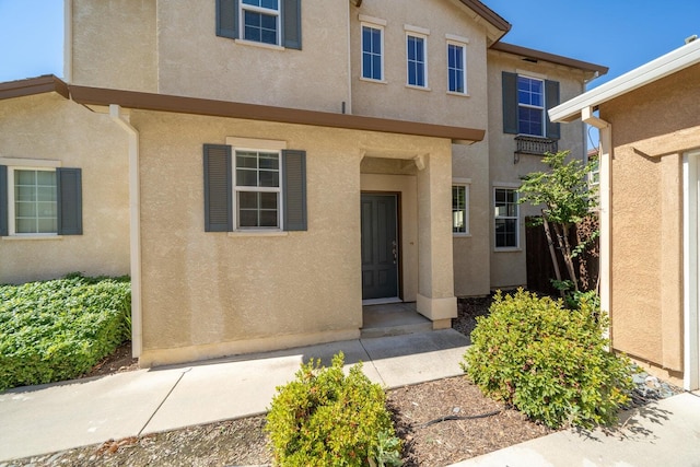 2340 Shining Star Way, Redding, CA 96003 - doorway to property featuring stucco siding