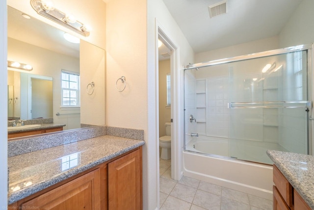 2340 Shining Star Way, Redding, CA 96003 - full bathroom with toilet, vanity, tile patterned flooring, and combined bath / shower with glass door