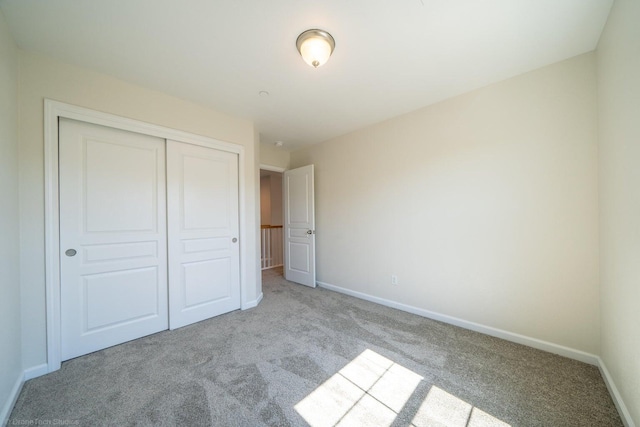 2340 Shining Star Way, Redding, CA 96003 - unfurnished bedroom featuring carpet floors, a closet, and baseboards