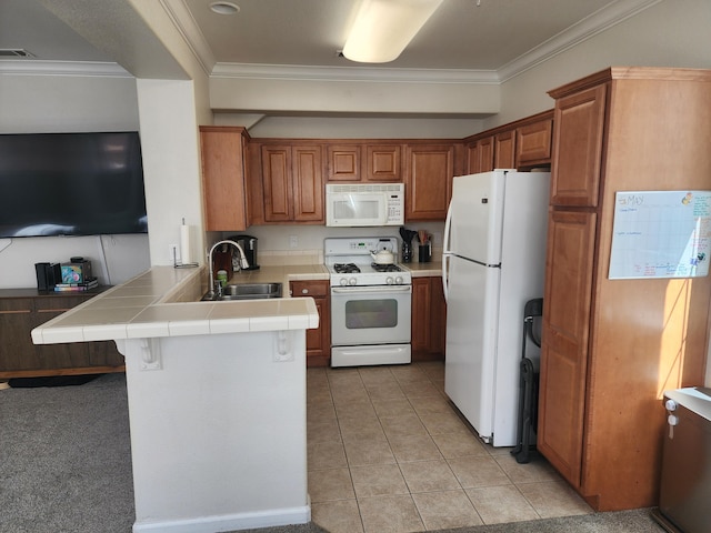 2340 Shining Star Way, Redding, CA 96003 - kitchen featuring white appliances, a sink, a peninsula, tile counters, and brown cabinetry