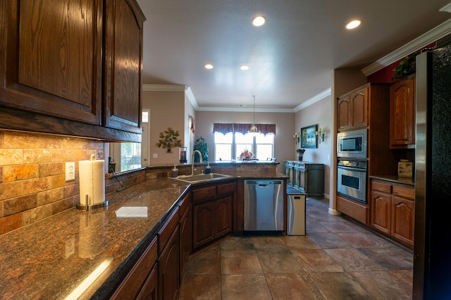 24943 Cox Ln, Los Molinos, CA 96055 - kitchen with appliances with stainless steel finishes, a sink, a peninsula, backsplash, and recessed lighting