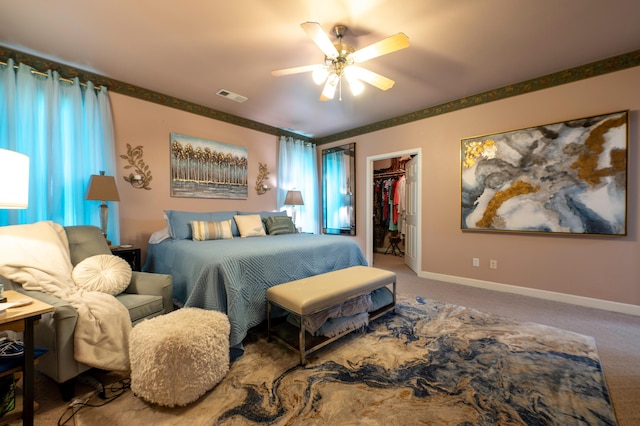 24943 Cox Ln, Los Molinos, CA 96055 - bedroom with carpet flooring, a walk in closet, a closet, ceiling fan, and baseboards