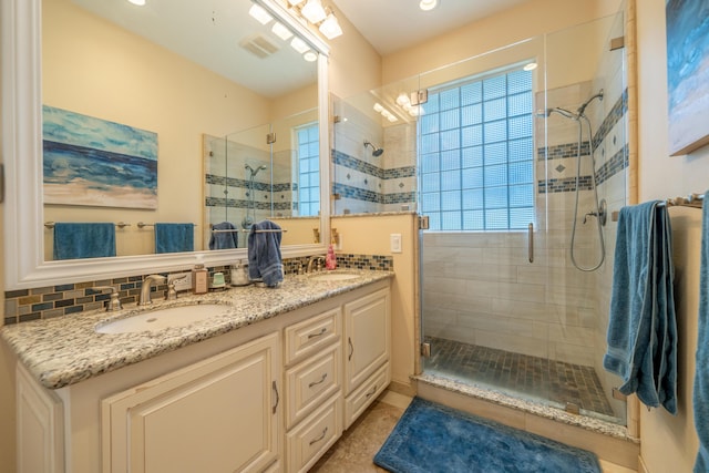 1030 Tulare Ct, Redding, CA 96003 - full bathroom with a stall shower, double vanity, tasteful backsplash, and recessed lighting