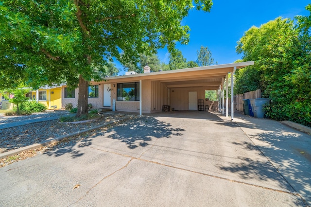 2006 Vale Dr, Redding, CA 96002 - view of front facade with concrete driveway and a chimney