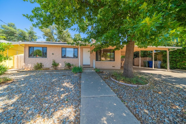 2006 Vale Dr, Redding, CA 96002 - view of front facade with brick siding and a carport