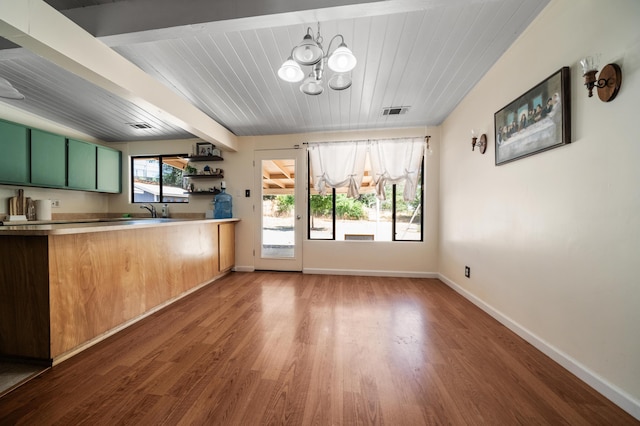 2006 Vale Dr, Redding, CA 96002 - kitchen with green cabinets, a chandelier, wood finished floors, baseboards, and wooden ceiling