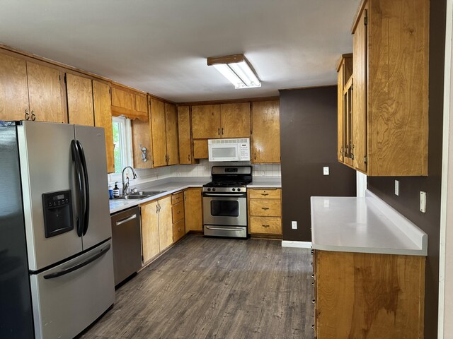 2392 Balls Ferry Rd, Anderson, CA 96007 - kitchen with stainless steel appliances, a sink, dark wood finished floors, brown cabinetry, and light countertops