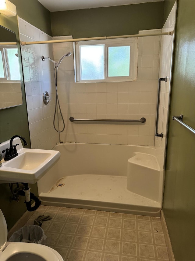 2392 Balls Ferry Rd, Anderson, CA 96007 - bathroom with a shower, toilet, tile patterned floors, and a sink