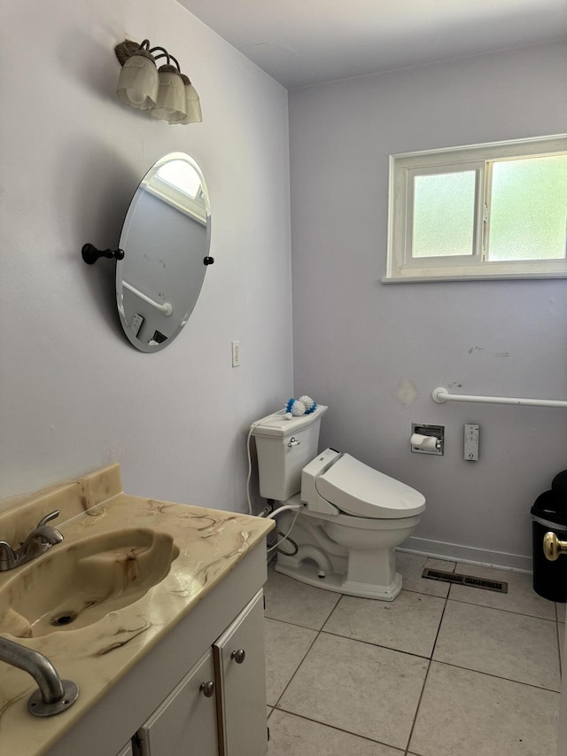 2392 Balls Ferry Rd, Anderson, CA 96007 - bathroom featuring vanity, toilet, plenty of natural light, and tile patterned flooring