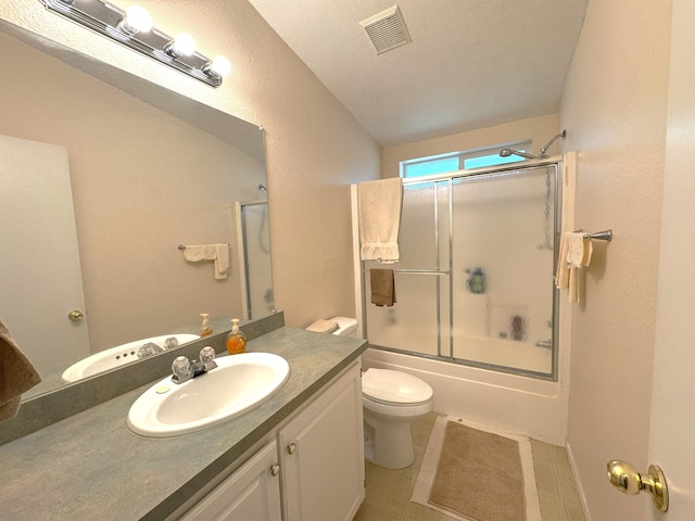 29093 Day Rd, Mcarthur, CA 96056 - full bathroom with toilet, vanity, shower / bath combination with glass door, vaulted ceiling, and tile patterned flooring