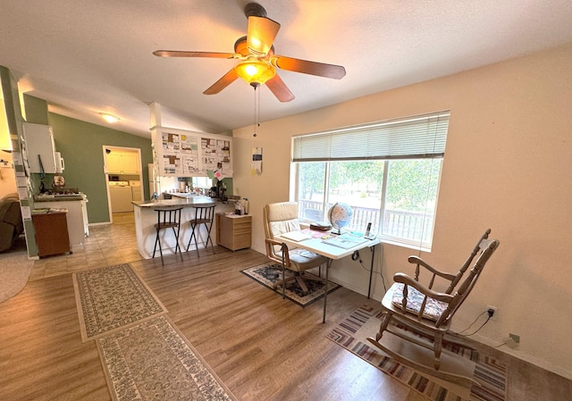 29093 Day Rd, Mcarthur, CA 96056 - dining space with light wood-style floors, ceiling fan, lofted ceiling, baseboards, and washer / clothes dryer