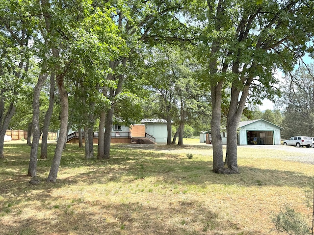 29093 Day Rd, Mcarthur, CA 96056 - view of green lawn with an outbuilding and a carport