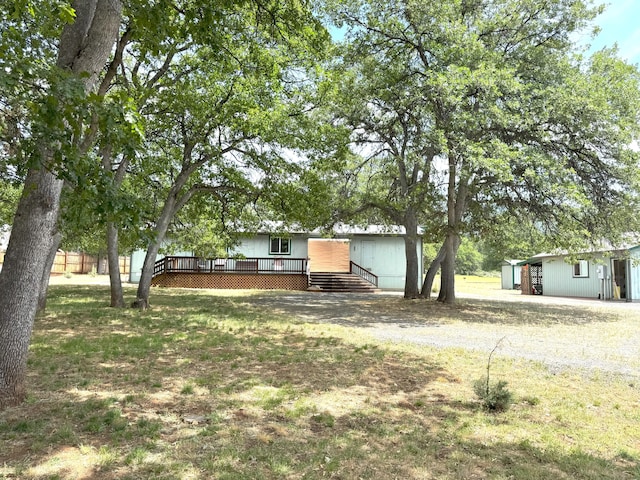 29093 Day Rd, Mcarthur, CA 96056 - view of yard with a deck, driveway, and an outbuilding