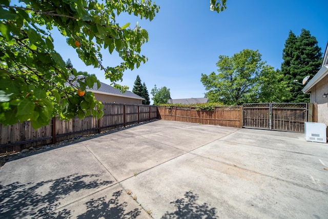 3921 Silver Lace Ln, Redding, CA 96001 - fenced backyard featuring a patio area and a gate