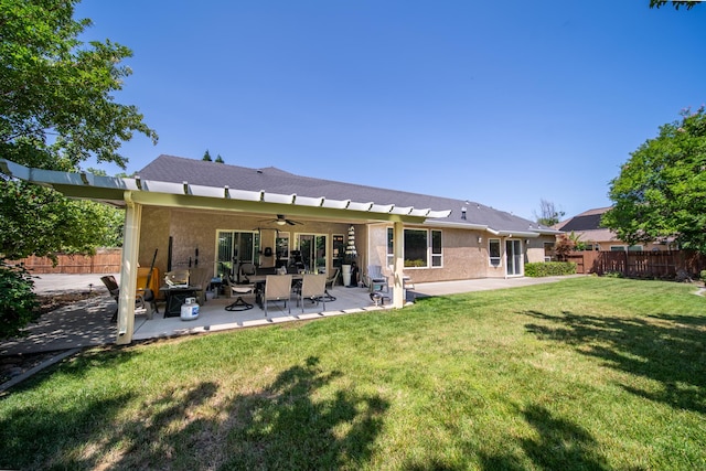 3921 Silver Lace Ln, Redding, CA 96001 - back of property with ceiling fan, stucco siding, and a patio area