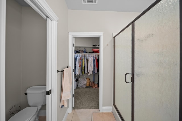 3921 Silver Lace Ln, Redding, CA 96001 - bathroom featuring a spacious closet, a shower stall, and tile patterned flooring