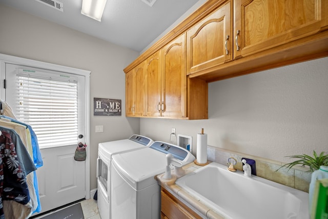 3921 Silver Lace Ln, Redding, CA 96001 - laundry room featuring washing machine and dryer and cabinet space