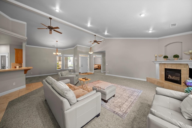 3921 Silver Lace Ln, Redding, CA 96001 - living area featuring a tiled fireplace, vaulted ceiling, a ceiling fan, a chandelier, and crown molding