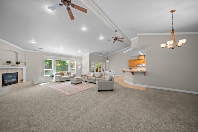 3921 Silver Lace Ln, Redding, CA 96001 - living room with a ceiling fan, a chandelier, light carpet, a tile fireplace, and crown molding