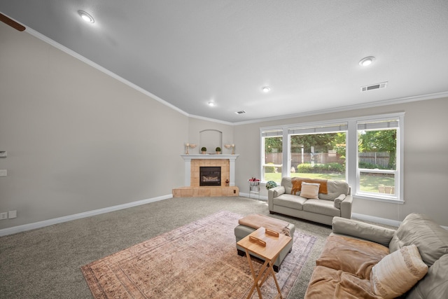 3921 Silver Lace Ln, Redding, CA 96001 - living room with carpet flooring, a tiled fireplace, recessed lighting, ornamental molding, and lofted ceiling